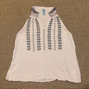 White sleeveless bohemian float blouse